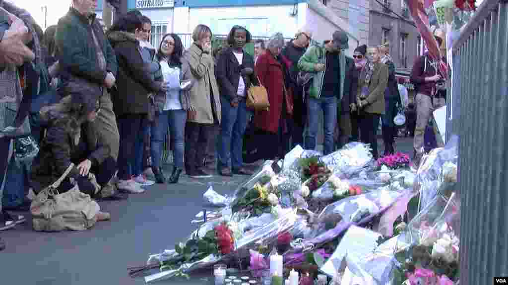 People gather outside the Bataclan music hall in Paris, France, Sunday Nov. 15, 2015. (Photo: L. Bryant / VOA)
