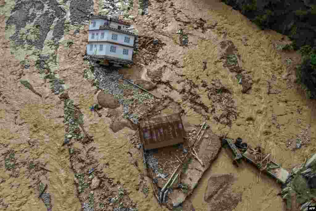An aerial view shows the area affected by monsoon flooding in Roshi village of Nepal's Kavre district. Search and rescue teams in the country's capital picked through wrecked homes after waters receded from monsoon floods that killed at least 209 people around the Himalayan republic.