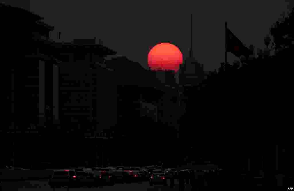 The sun sets behind Tiananmen Gate in Beijing ahead of the 70th anniversary of the founding of the People's Republic of China.