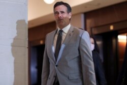 FILE - Director of National Intelligence John Ratcliffe arrives to brief congressional leaders, on Capitol Hill in Washington, July 2, 2020.