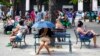 FILE - People surf the Internet at a Wi-Fi hotspot in Havana, Cuba, Nov. 25, 2015.