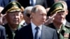 Russian President Vladimir Putin attends a wreath-laying ceremony marking the 75th anniversary of the Nazi German invasion, by the Kremlin walls in Moscow, Russia, June 22, 2016.
