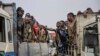 M23 rebels escort government soldiers and police who surrendered to an undisclosed location in Goma, Democratic Republic of the Congo, Jan. 30, 2025. 
