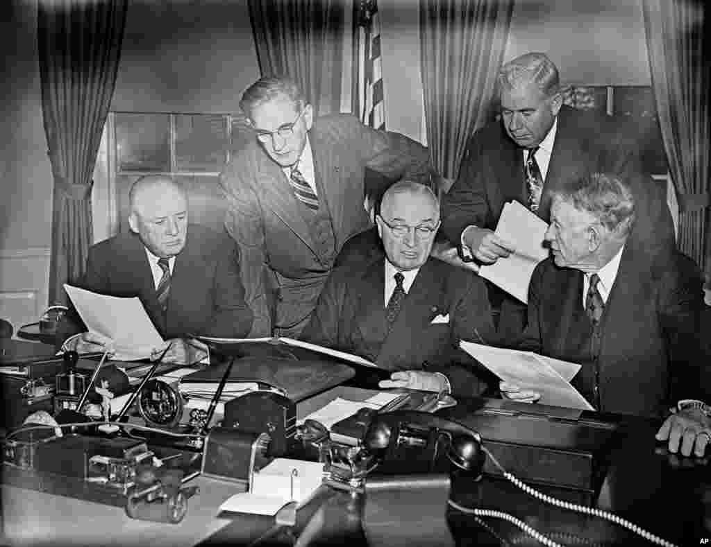 President Harry Truman checks the final draft of his “State of the Union” speech with congressional leaders before going to the capitol to deliver it, Jan. 8, 1951.