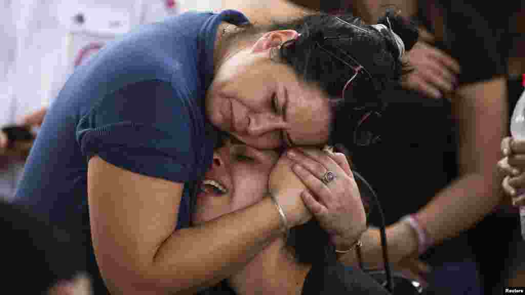 Friends and relatives of Daniel Tregerman, a 4-year-old Israeli boy, mourn during his funeral in a cemetery near the border with the Gaza Strip, Aug. 24, 2014.