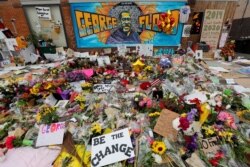 Items left by protesters to memorialize George Floyd, who died in Minneapolis police custody, are seen at the scene of his arrest in Minneapolis, Minnesota, June 4, 2020.