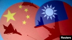 Chinese and Taiwanese national flags are displayed alongside military airplanes in this illustration taken April 9, 2021. (REUTERS/Dado Ruvic/Illustration)