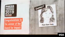FILE - Reporters Without Borders (RSF) awarded Vietnamese journalist and blogger Pham Doan Trang a 2019 Press Freedom Prize for Impact, Sept. 12, 2019, in Berlin, Germany..