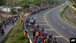 Central American migrants, part of the caravan hoping to reach the U.S. border, walk in Frontera Hidalgo, Mexico, April 12, 2019.