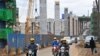 FILE - Motorists drive near a construction site of the Nairobi Expressway, undertaken by the Chinese contractor China Road and Bridge Corporation, in Nairobi, Kenya, July 12, 2021. A new report says China's investment in Kenya has dropped significantly. 