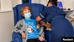 Margaret Keenan, 90, is the first patient in Britain to receive the Pfizer/BioNtech COVID-19 vaccine at University Hospital Dec. 8, 2020. (Jacob King/Pool via REUTERS)