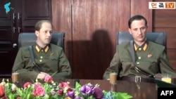 FILE - This screen grab taken Aug. 21, 2017, from an undated YouTube video released by Uriminzokkiri shows Ted Dresnok, right, son of US defector to North Korea James Joseph Dresnok, and his brother, James, during an interview at an unknown location. Uriminzokkiri, the state-run North Korea propaganda channel, has now been pulled from the YouTube website.