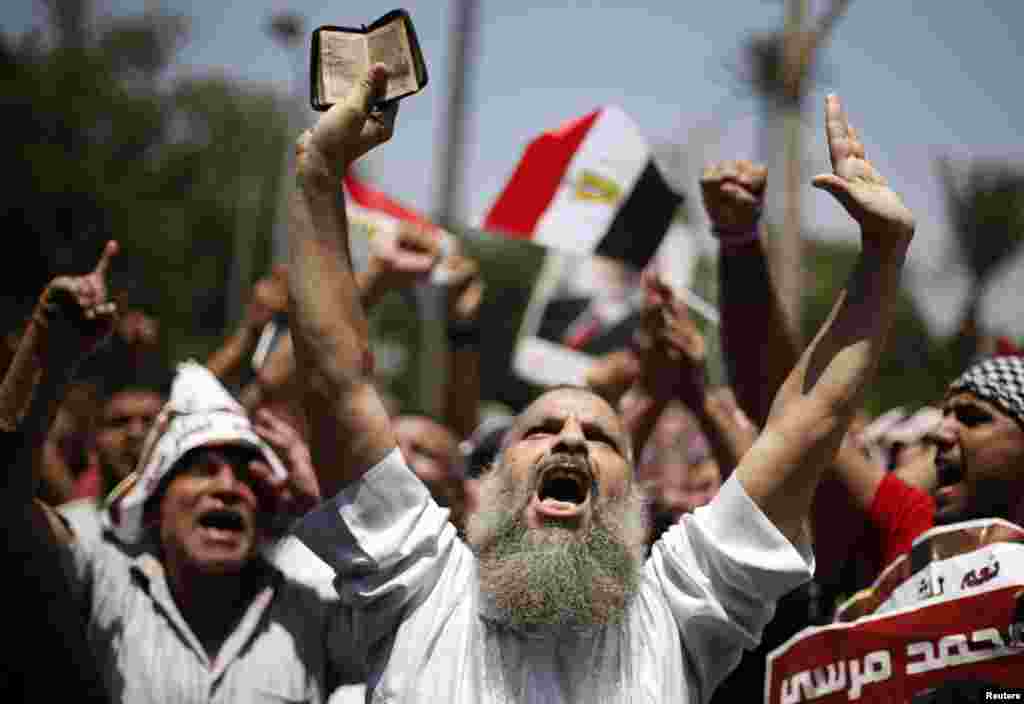 A supporter of former Egyptian President Mohamed Morsi chants slogans during a rally near Cairo University after Friday prayers in Cairo, Egypt, July 5, 2013. 