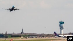 FILE - A plane takes off at Brussels Airport, in Zaventem, Belgium, April 3, 2016.
