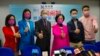 Members of New People's Party, from left, Judy Chan, Eunice Yung, Lai Tung-kwok, Regina Ip, Dominic Lee and Marcus Liu pose for a photograph after winning the legislative election in Hong Kong, Dec. 20, 2021. (AP Photo/Kin Cheung)