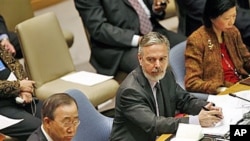 Antonio de Aguiar Patriota, center, Foreign Minister of Brazil looks at Secretary General Ban Ki-moon, left, at a Security Council meeting to discuss maintenance of International Peace and Security at United Nations Headquarters in New York, February 11,