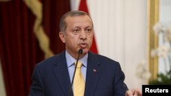 Presiden Turki Recep Tayyip Erdogan dalam kunjungan ke Jakarta (31/7). (Reuters/Darren Whiteside)