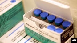 FILE -- Measles, mumps and rubella vaccines sit in a cooler at the Rockland County Health Department in Pomona, N.Y., March 27, 2019. 