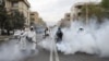 Members of firefighters wear protective face masks, amid fear of coronavirus disease (COVID-19), as they disinfect the streets, ahead of the Iranian New Year Nowruz, March 20, in Tehran, Iran March 18, 2020. Picture taken March 18, 2020. WANA (West…