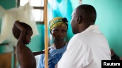 A child with measles infection at an isolation war in Congo.