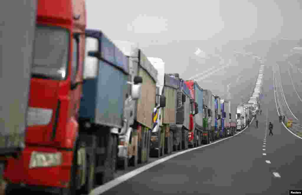 Trucks are seen on a highway near the Kulata border crossing between Bulgaria and Greece, Bulgaria. Bulgarian truckers staged a counter-blockade at a checkpoint on the country's border with Greece, after Greek protesters failed to keep a promise to lift their own blockade for a few hours a day.