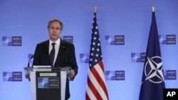 U.S. Secretary of State Antony Blinken delivers remarks with NATO Secretary General Jens Stoltenberg prior to a NATO foreign ministers meeting at NATO headquarters in Brussels, Tuesday, March 23, 2021. (Yves Herman, Pool via AP)