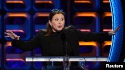 FILE - Carrie Fisher speaks during the taping of the Comedy Central Roast of Roseanne in Los Angeles, Aug. 4, 2012.