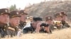 North Korean leader Kim Jong Un guides artillery fire competition in this image released by North Korea's Korean Central News Agency on March 20, 2020.
