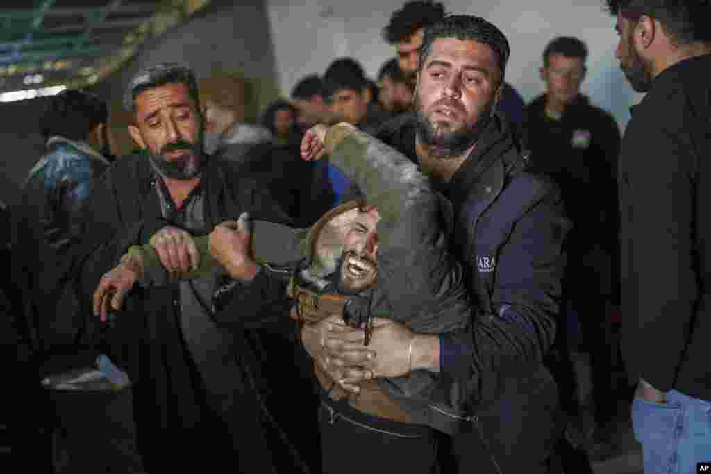 A man mourns during the death of Ibrahim al-Hamad, who was killed by a Turkish-backed militia, during the funeral of four Syrian Democratic Forces fighters in the village of Daoudiya in northeastern Syria's Hassakeh province.