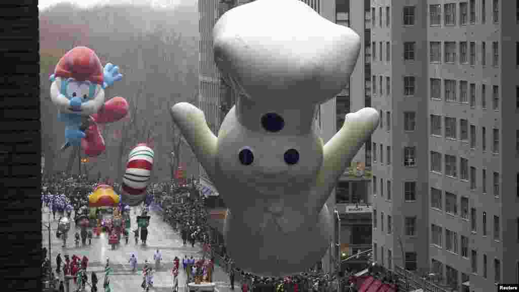 The Pillsbury Doughboy float makes its way down Sixth Avenue during the Macy's Thanksgiving Day Parade in New York, Nov. 27, 2014.
