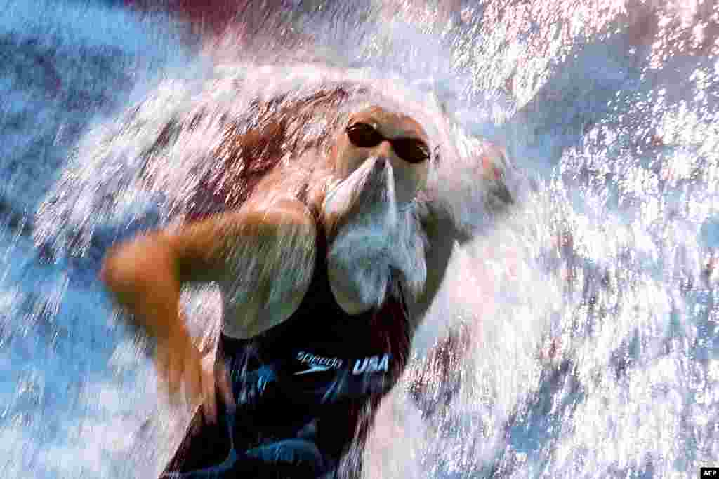 An underwater camera shows Katie Ledecky of the United States competing in a heat of the women's 800m freestyle during a swimming competition at the 2017 FINA World Championships in Budapest.