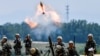 FILE - Soldiers of the Chinese People's Liberation Army fire a mortar during an exercise in Anhui province, China, May 22, 2021.