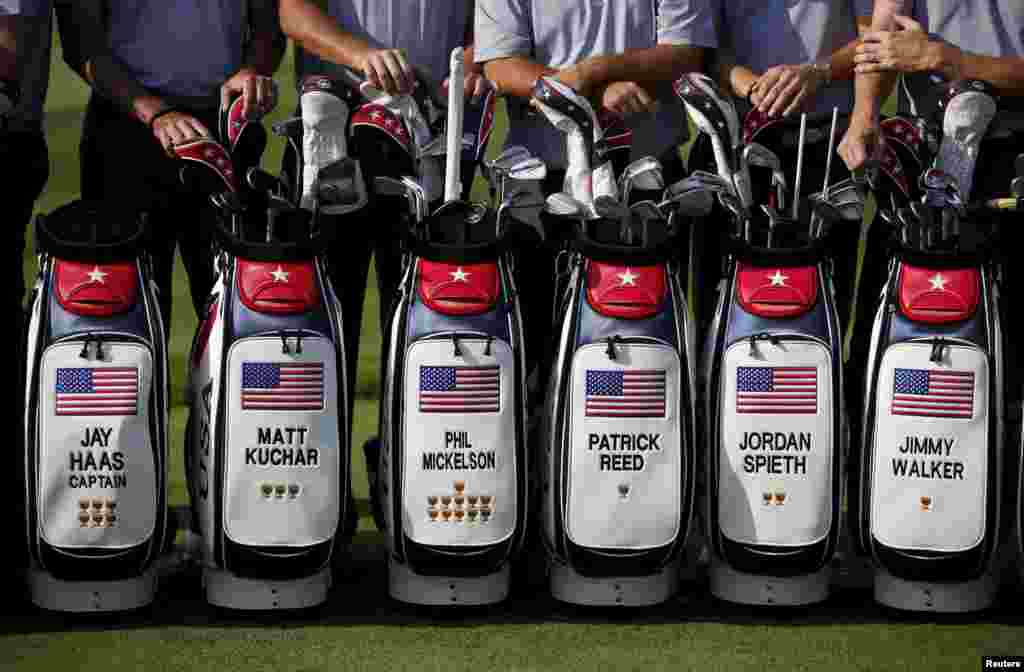 U.S. team members pose for a group photo before the start of the first round of the 2015 Presidents Cup golf tournament at the Jack Nicklaus Golf Club in Incheon, South Korea.