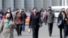 Pedestrians wear face masks to help prevent the spread of the coronavirus, in Pyongyang, North Korea, April 1, 2020. 