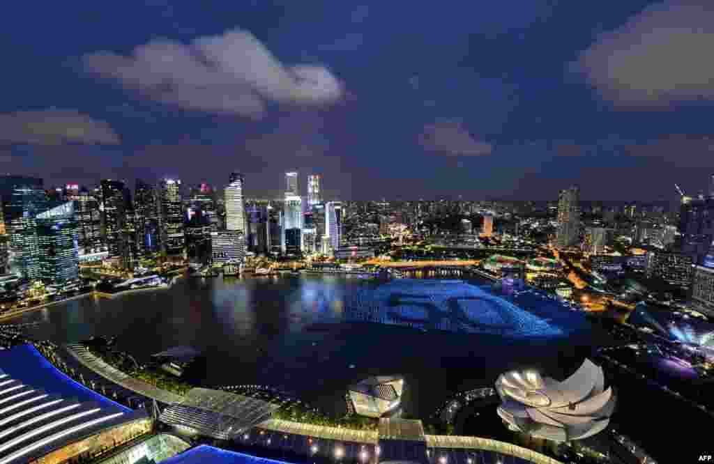 Singapore's skyline gliters with lights as spheres in the waters of Marina Bay form the number '50' to mark Singapore’s 50th anniversary in 2015, ahead of the New Year's countdown celebrations, Dec. 31, 2014.