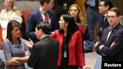 U.S. Ambassador to the United Nations Nikki Haley (L) speaks with Chinese Deputy Ambassador to the United Nations Wu Haitao (R) ahead of the United Nations Security Council session on imposing new sanctions on North Korea. (REUTERS/Amr Alfiky)