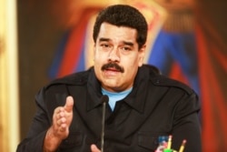 FILE - Venezuela's President Nicolas Maduro speaks during a meeting with mayors and governors at Miraflores Palace in Caracas, May 19, 2014.