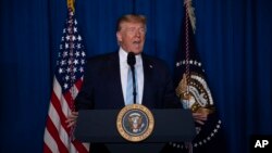 President Donald Trump delivers remarks on Iran, at his Mar-a-Lago property, Friday, Jan. 3, 2020, in Palm Beach, Fla. (AP Photo/ Evan Vucci)