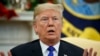 In this Dec. 11, 2018 photo, President Donald Trump speaks during a meets with Democratic leaders the Oval Office in Washington. 