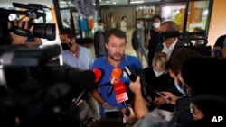 Right-wing opposition leader Matteo Salvini leaves a polling station, in Milan, Italy, Sept. 21, 2020.