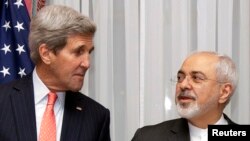 U.S. Secretary of State John Kerry, left, and Iran's Foreign Minister Mohammad Javad Zarif are seen before resuming talks over Iran's nuclear programme in Lausanne, Switzerland, March 16, 2015. 