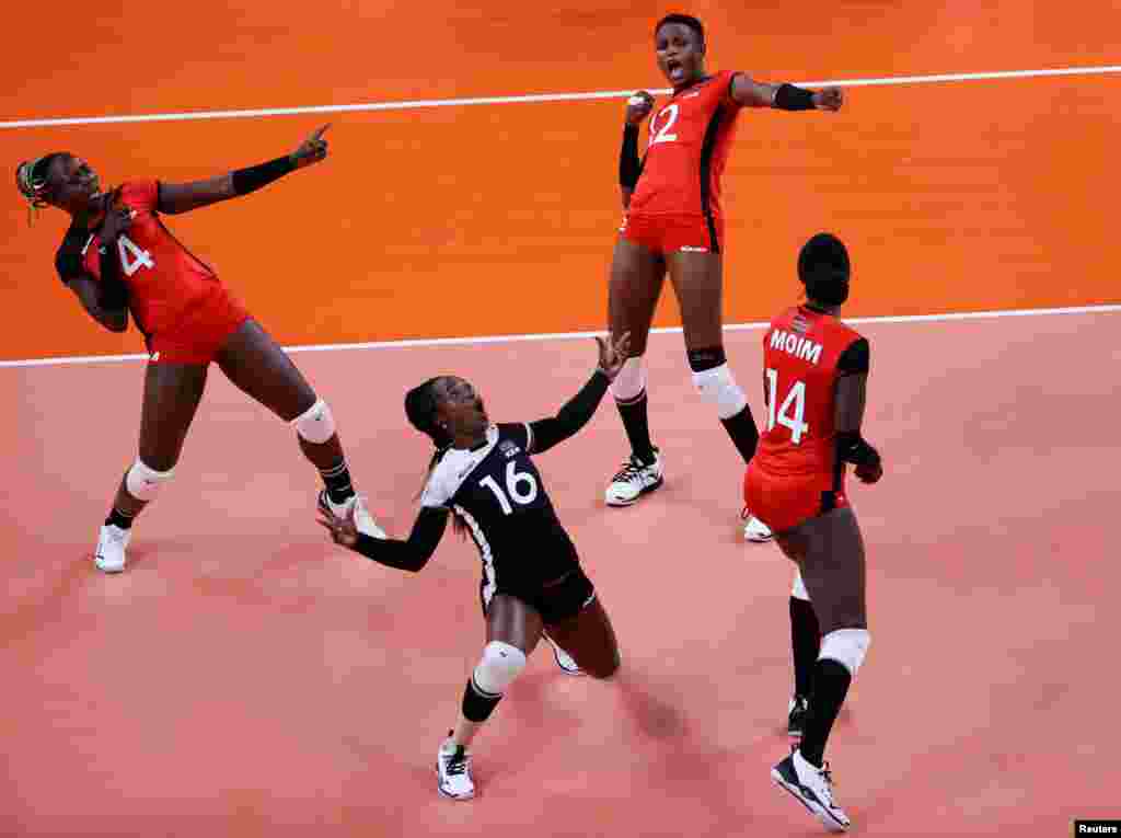 Leonida Kasaya of Kenya, Gladys Ekaru of Kenya and Agripina Kundu of Kenya celebrate during the Tokyo Olympics Volleyball - Women's Pool A South Korea v Kenya. REUTERS/Valentyn Ogirenko