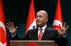 FILE - Iraq's President Barham Salih speaks to the media during a joint news conference with Turkey's President Recep Tayyip Erdogan, in Ankara, Turkey, Jan. 3, 2019.