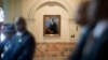 FILE - A portrait of the Rev. Martin Luther King Jr. hangs in a hallway of the Georgia State Capitol in Atlanta during a ceremony paying tribute to King, Jan. 17, 2014