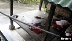 The blood of a terror suspect is seen at the site of a shooting in a rented villa in Sanur on the Indonesian island of Bali, March 19, 2012. 
