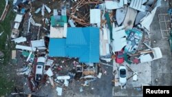 Los daños causados por tornados se revelan a la luz de la mañana después de que los tornados arrasaron el área de Indian Lake en el condado de Logan, Ohio, EEUU, 15 de marzo de 2024. 