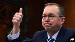 Budget director Mick Mulvaney testifies before the Senate Budget Committee on Capitol Hill in Washington, Feb. 13, 2018. The Trump administration is pushing a “bold new approach to nutrition assistance" — replacing the traditional cash on a card that food
