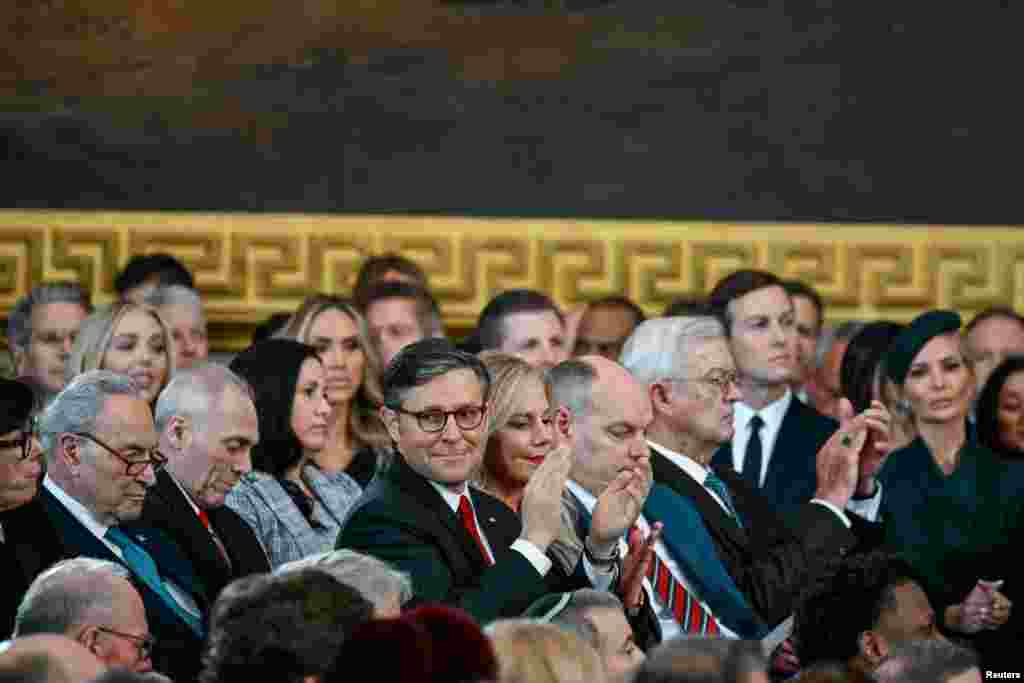 Speaker Mike Johnson listens as President Donald J. Trump speaks after being sworn as the 47th president of the United States inside the Capitol Rotunda of the U.S. Capitol building in Washington, Jan. 20, 2025.
