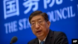 Zeng Yixin, Vice Minister of China's National Health Commission, speaks at a press conference at the State Council Information Office in Beijing, Thursday, July 22, 2021. (AP Photo/Mark Schiefelbein)