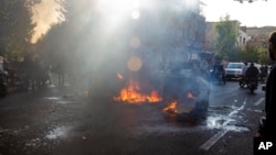 FILE - In this photo taken by an individual not employed by the Associated Press and obtained by the AP outside Iran, Iranians protests the death of 22-year-old Mahsa Amini, in Tehran, Thursday, Oct. 27, 2022. 